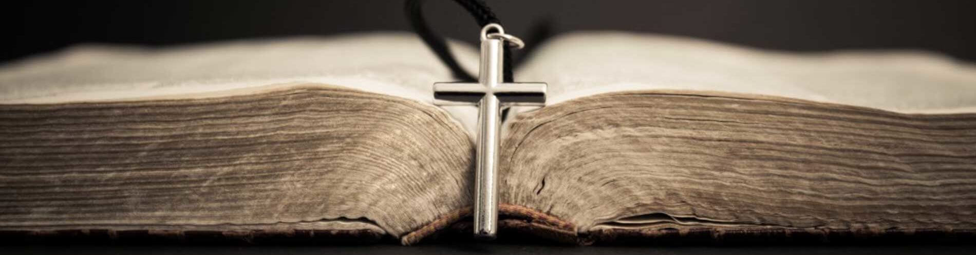 Open Bible with cross