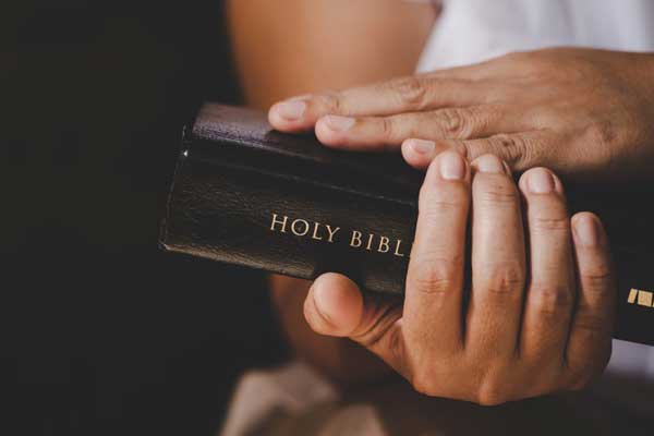Hands Holding Bible