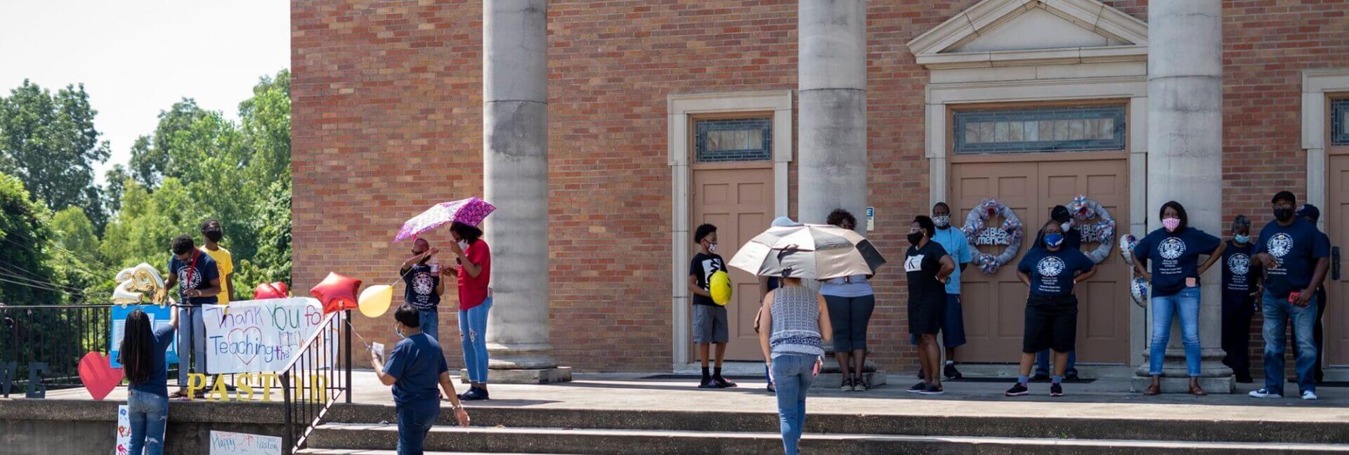 A group gathering on the church steps